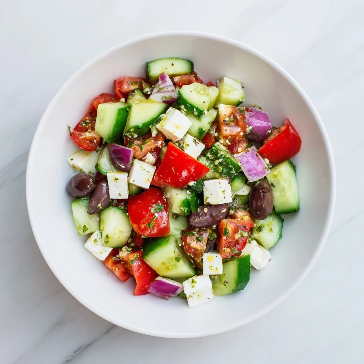 Bright, flavorful photo of Fresh Mediterranean Salad featuring olives, crisp veggies, and a tangy dressing.