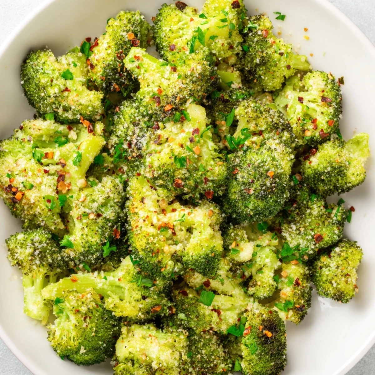 Golden brown Garlic Parmesan Roasted Broccoli, ready for serving, smells wonderfully of garlic and cheese.