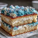 Moist vanilla sheet cake topped with smooth buttercream and Class of 2026 piping, perfect for graduation celebrations.  