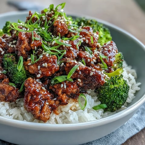 Overhead view of Sweet and Spicy Turkey Broccoli Bowls with saucy ground turkey and steamed broccoli florets.