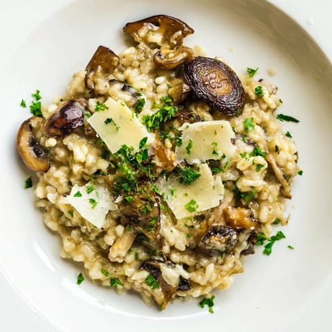 Close-up shot shows creamy Italian Mushroom Risotto with perfectly cooked, flavorful mushrooms.