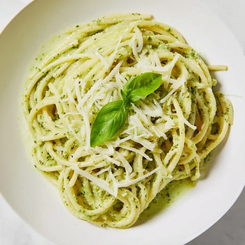 Creamy Sunflower Seed Pesto Pasta tossed with al dente spaghetti, fresh basil, and a swirl of rich cream sauce.