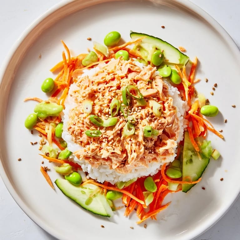 This vibrant Spicy Canned Salmon Rice Bowl features creamy salmon, crunchy veggies, and a spicy kick.